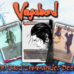 May include: A 100-card Commander deck titled Vagabond featuring three trading cards with samurai illustrations. The centre card depicts Miyamoto Musashi, while the flanking cards show Sasaki Kojiro and a Defensive Stance action scene.