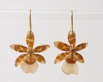 Handgefertigte Ohrringe aus Harz mit exotischen goldenen Orchideen und Leopardenmuster