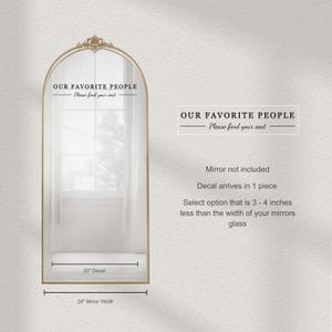May include: A gold-framed mirror with an arched top and decorative detailing. The text "OUR FAVORITE PEOPLE - Please find your seat" is displayed above the mirror. The decal is 51 cm wide and the mirror width is 61 cm.