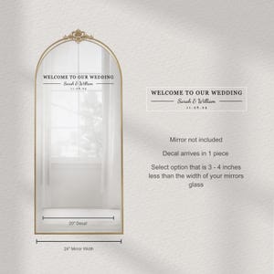 May include: A gold-framed arched mirror with the text "WELCOME TO OUR WEDDING" above the names "Sarah & William" and the date "11.26.25". The decal is 50.8 cm wide and designed for a 61 cm mirror.