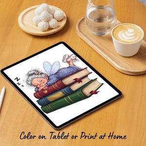 May include: A digital tablet displaying a colorful illustration of an elderly person with gray hair and blue fairy wings sleeping on a stack of three books. The books are red, blue, and green with gold accents. The text ZZZ appears near the person.