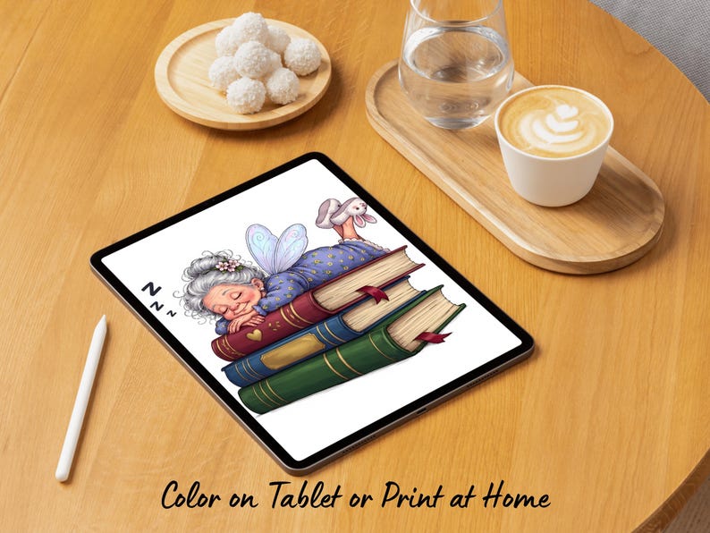 May include: A digital tablet displaying a colorful illustration of an elderly person with gray hair and blue fairy wings sleeping on a stack of three books. The books are red, blue, and green with gold accents. The text ZZZ appears near the person.