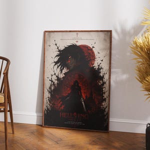 May include: A rectangular poster featuring a dark, stylized illustration of a character with long hair, a red moon, and black ink-like splatters. The text HELLSING is printed in red at the bottom, accompanied by smaller text and a cross symbol.