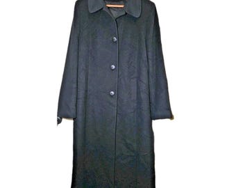 May include: A long, black coat with a rounded collar and three buttons down the front. The coat is hanging on a wooden hanger. The coat appears to be made of a wool blend.