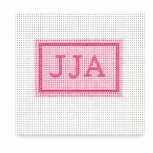 May include: A needlepoint canvas with a pink rectangular border and the letters "JJA" in the center. The letters and border are in a darker shade of pink against a white background.