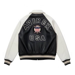 Front view of black and white Avirex USA leather varsity bomber jacket with embroidered chest patch, zip front closure, striped ribbed hem and cuffs, handmade premium leather jacket
