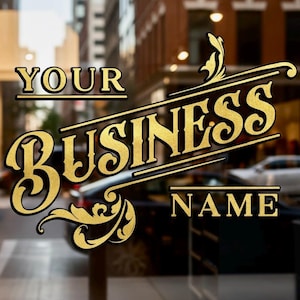 May include: Gold-colored text on a glass storefront window. The text reads "YOUR BUSINESS NAME" in a decorative font. The background is a blurred street scene with buildings and cars.