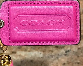 Coach fuchsiaroze leren hanglabeltas en groot label merkloos kwastje