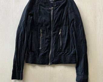 May include: Black jacket with a zip-up front, two zippered pockets, and a stand-up collar. The jacket has a ribbed hem and cuffs. The brand name "Weekend" is visible on the back of the collar.
