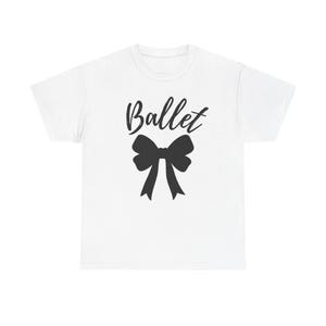 May include: White t-shirt featuring the word "Ballet" in a cursive font above a black bow graphic. The bow has a classic shape with two long, flowing ribbons. The design is centered on the shirt, offering a clean and simple aesthetic.