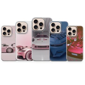 May include: Five phone cases featuring images of sports cars in various colors, including pink, white, and blue. The cases have a clear border and a glossy finish, showcasing the car designs.