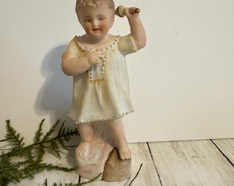 Antique Bisque Child Figurine with Rattle - German/ European Style, Tree Stump Base, Vintage Porcelain Decor