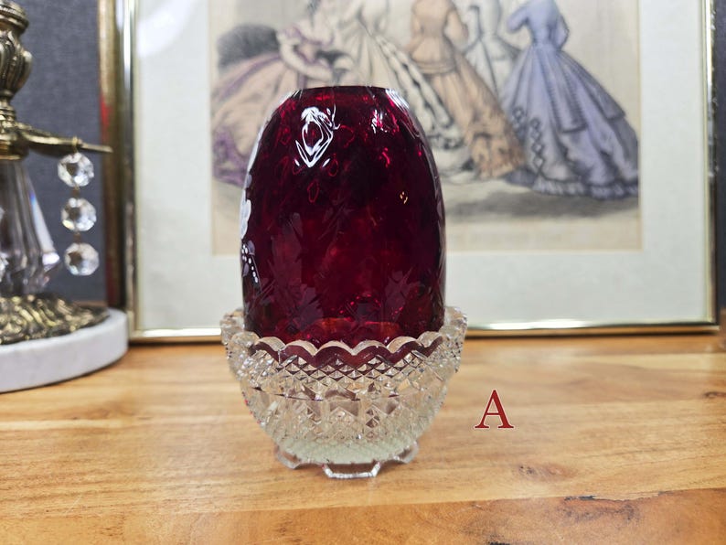 Side view of fairy lamp A showing the red glass shade in the clear pressed glass base
