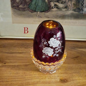 Fairy lamp labeled B lit from inside with warm yellow light