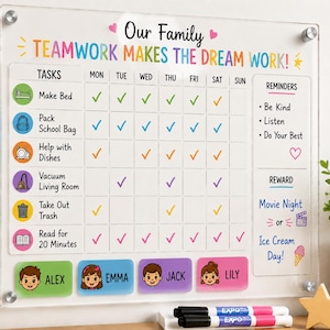 May include: A clear acrylic family chore chart featuring the text Our Family TEAMWORK MAKES THE DREAM WORK! It includes a grid for tasks like Make Bed and Pack School Bag, columns for days of the week, a reminders section, and a reward area.