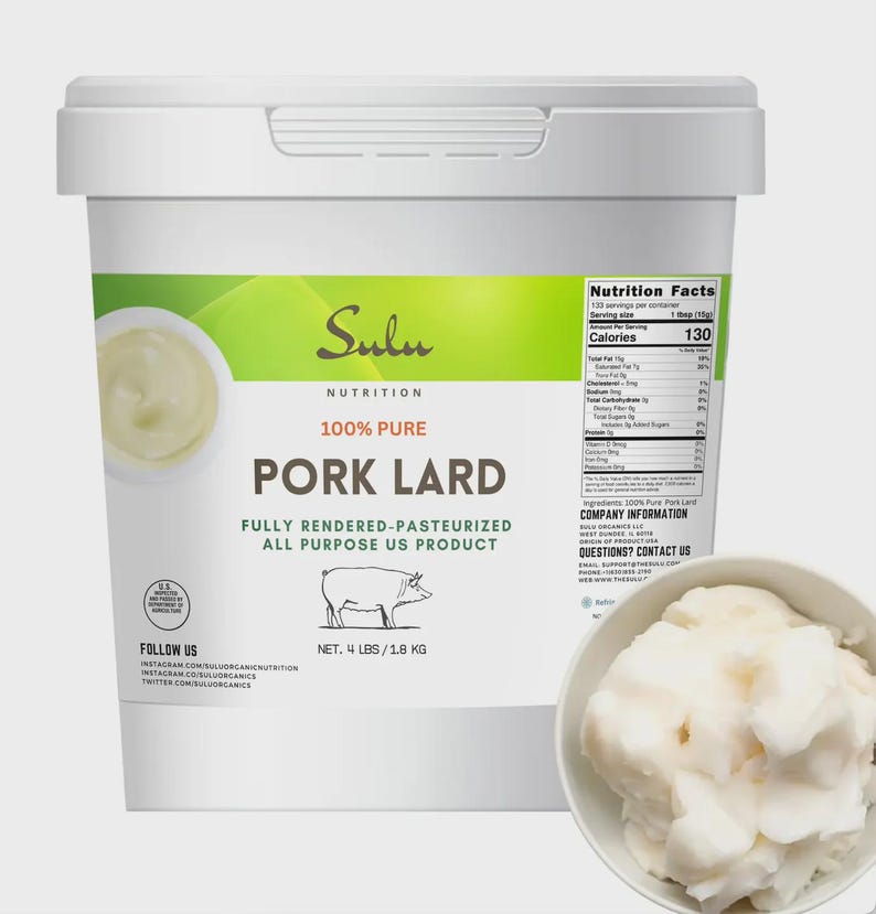 May include: A white container of Sulu Nutrition 100% Pure Pork Lard. The container has a green and white label with the text "Pork Lard" and a drawing of a pig. The net weight is 1.8 kg. A small bowl of lard is in the foreground.
