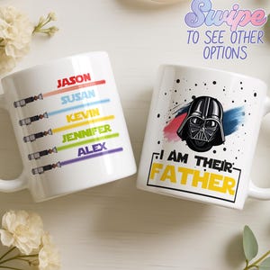 May include: Two white ceramic mugs. One mug features names with colored lightsaber designs. The other mug has a Darth Vader graphic with the text "I AM THEIR FATHER". The image also includes the text "Swipe TO SEE OTHER OPTIONS".