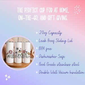 three white ceramic cups with colorful floral designs, placed on a wooden surface.