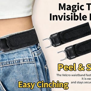 May include: A black fabric belt with a hook-and-loop closure system, featuring metal hardware that attaches to blue denim jeans. The text reads Magic Tape Invisible Belt, Peel & Stick, and Easy Cinching. The belt is designed to tighten the waistband.