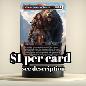May include: A Magic: The Gathering card featuring "Winota, Joiner of Forces" with a woman and a bear. The card is a Legendary Creature - Human Warrior. The card is displayed on a black stand.