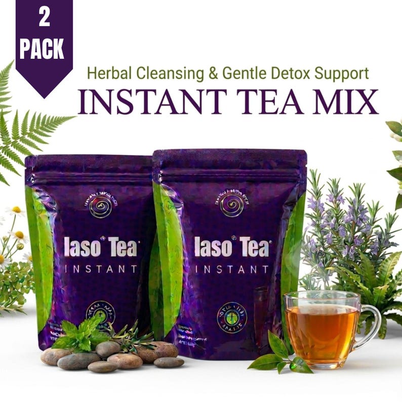 May include: Two purple pouches of Iaso Tea Instant herbal cleansing and gentle detox support tea mix. The packaging features the text 2 PACK, Herbal Cleansing & Gentle Detox Support, and INSTANT TEA MIX. A glass cup of brewed tea sits nearby.