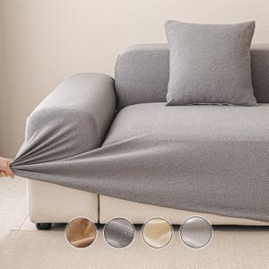 May include: A gray sofa cover being stretched over a white sofa. A gray pillow rests on the sofa. Four color swatches are displayed at the bottom of the image, showing different fabric options.