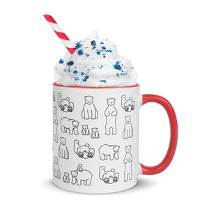 May include: White ceramic mug with a red interior and handle, filled with whipped cream and a red and white striped straw. The mug is decorated with black line drawings of polar bears in various poses.