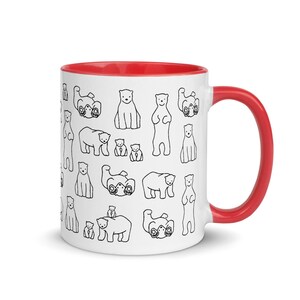 May include: White ceramic mug with a red interior and handle. The mug is decorated with a repeating pattern of black line-drawn polar bears in various poses. A fun and whimsical design for a coffee or tea cup.