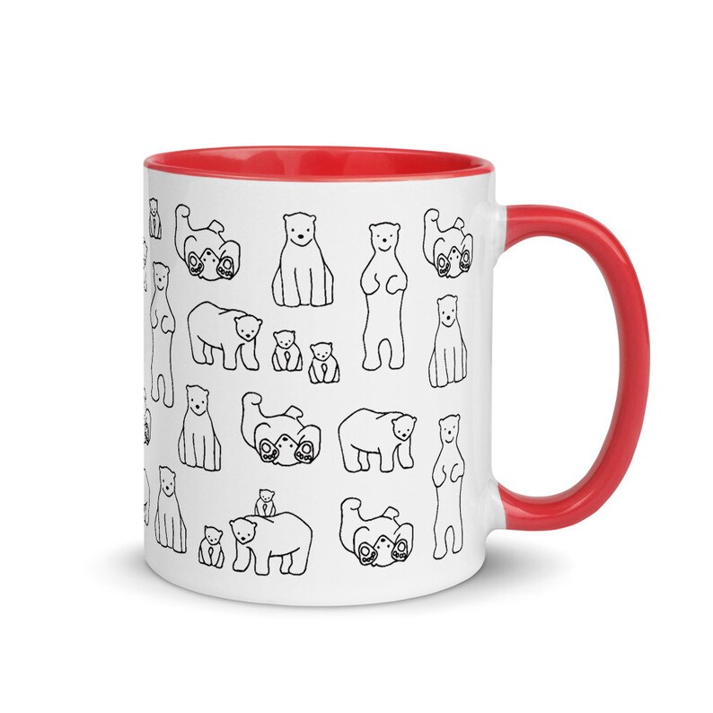 May include: White ceramic mug with a red interior and handle. The mug is decorated with a repeating pattern of black line-drawn polar bears in various poses. A fun and whimsical design for a coffee or tea cup.