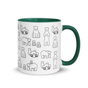 May include: White ceramic mug with a green interior and handle. The mug is decorated with a repeating pattern of black line-drawn polar bears in various poses. A fun and whimsical design for a coffee or tea cup.