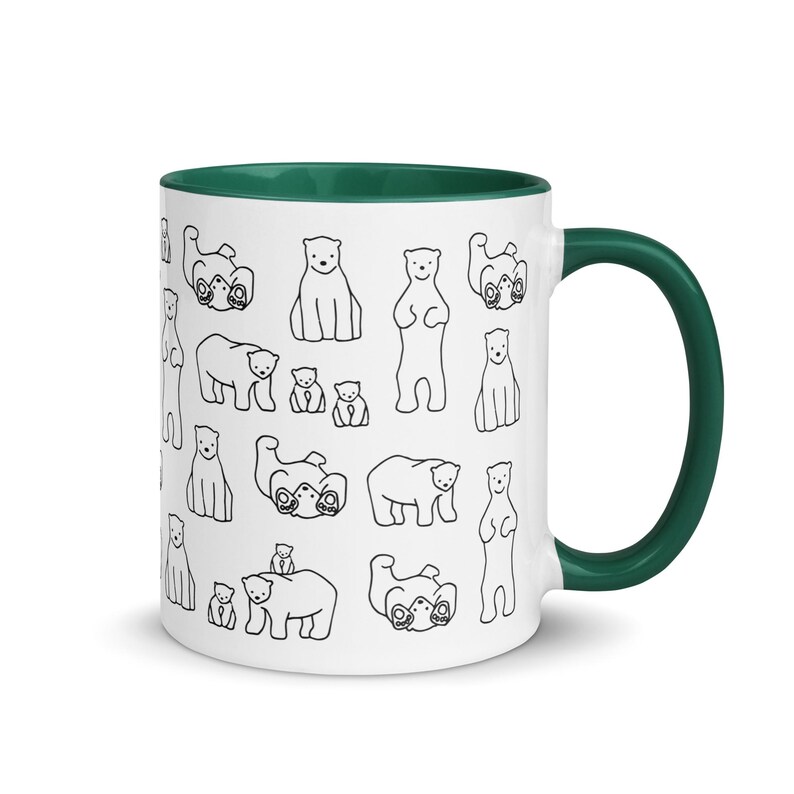 May include: White ceramic mug with a green interior and handle. The mug is decorated with a repeating pattern of black line-drawn polar bears in various poses. A fun and whimsical design for a coffee or tea cup.