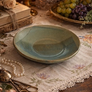 May include: A rustic wooden sign with the text "Welcome to our home" in white lettering. The sign features a distressed finish and a simple, inviting design, perfect for a front porch or entryway.