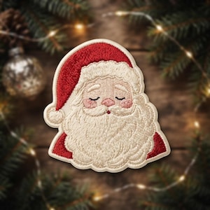 May include: An embroidered patch featuring the face of Santa Claus with a red hat, a thick cream-colored beard, and closed eyes. The design includes pink cheeks and a small red nose, with detailed stitching throughout the entire figure.