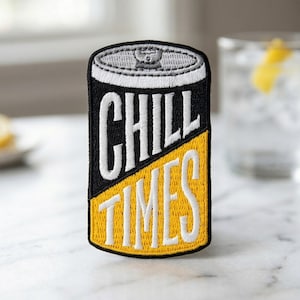 May include: An embroidered patch shaped like a beverage can with a black top half and a yellow bottom half. The text CHILL TIMES is stitched in white across the center. The top of the can is depicted in grey with a tab detail in the center.