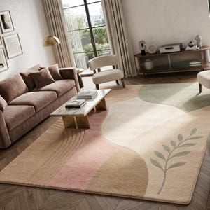 May include: A rectangular area rug featuring a soft, multi-colored abstract design with curved sections in shades of beige, cream, dusty pink, and sage green. The rug includes a subtle embossed leaf pattern and linear arc details on the surface.
