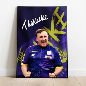 May include: A framed portrait of a man in a blue and yellow sports jersey. The background is purple with yellow brushstroke designs. The name "TheNuke" is written in white script at the top. The man is smiling with clenched fists.
