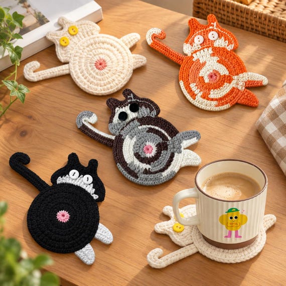 Crochet cat butt coasters that present the full moon every time someone sets down their coffee — functional, handmade, and impossible not to laugh at.