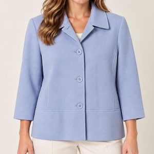 May include: A light blue jacket featuring a classic collar, three-quarter length sleeves, and a front button closure with three matching buttons. The garment has a structured fit with vertical seam detailing on the front panels and a clean hemline.