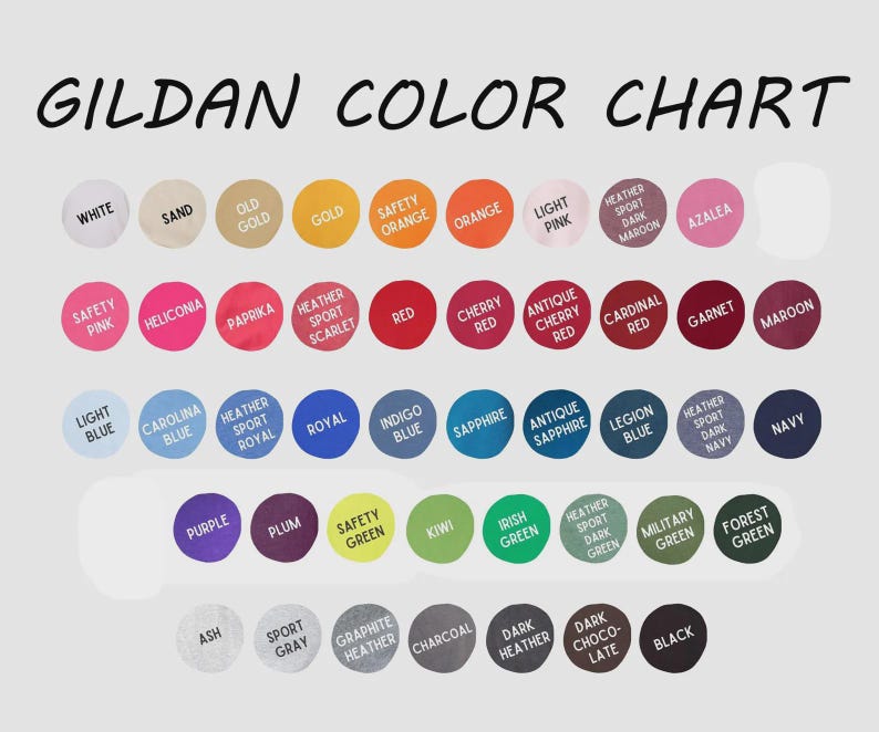 May include: A Gildan color chart featuring rows of circular swatches in various shades including white, sand, gold, orange, pink, red, blue, purple, green, gray, brown, and black. Each circle is labeled with its corresponding color name in text.