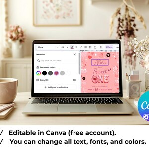 May include: A laptop displays a pink invitation design with the text "Alice is Sweet ONE." The laptop is open on a wooden desk, next to a coffee cup, notebook, and flowers. The Canva logo is visible.