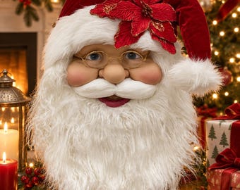 May include: A Santa Claus head figurine featuring a plush red velvet hat adorned with a large red poinsettia flower. The figure has a thick white faux fur beard, a mustache, rosy cheeks, and gold-rimmed spectacles over blue eyes.