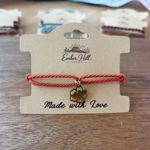 Boho Hair Tie Braclet Set, 2 in 1 Elastic Ponytail Holder, Stacking Bracelets, Coral with Gold Toned Hibiscus Charm , Pack of 1