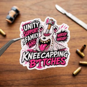 May include: A die-cut sticker featuring a cartoon creature with an axe in its head, a pink tongue, and the text: UNITY SUPPORT FAMILY AND KNEECAPPING BITCHES, with WHOOP WHOOP! in a speech bubble. The design uses black, white, and vibrant pink colors.