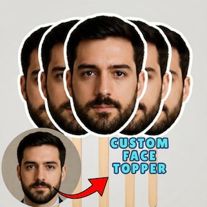 May include: A set of custom face toppers featuring a repeating cutout of a man with dark hair and a beard, mounted on wooden sticks. The image includes a circular inset of the same face and the blue text CUSTOM FACE TOPPER with a red arrow.