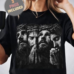 May include: A black t-shirt featuring a graphic print of four monochromatic portraits of a bearded figure wearing a crown of thorns, with hands clasped in prayer. A circular badge in the upper left corner contains the text 3 PNGS INCLUDED.