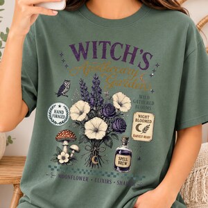 Printable Retro Witch Herb Garden PNG mockup featuring cottagecore botanical art, enchanted floral bouquet, mushrooms, apothecary elements, vintage Halloween aesthetic, transparent background digital design for T-shirts and sweatshirts.