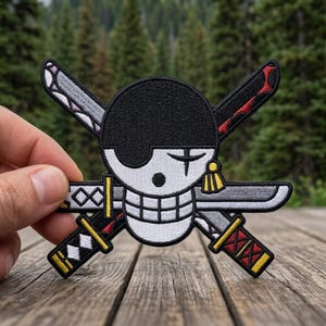May include: Embroidered patch featuring a skull with an eye patch and crossed swords. The patch is black, white, gray, red, and yellow. The swords have gray blades and red and yellow accents. The skull has a black eye patch and a white face.