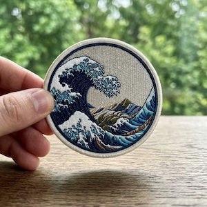 May include: A handmade wooden sign with the text "Welcome" in a playful font. The sign features a distressed white background and a dark brown border, perfect for a front door or entryway.