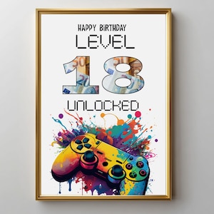 Könnte beinhalten: Gerahmter Druck mit dem Text "HAPPY BIRTHDAY LEVEL 18 UNLOCKED". Die Zahlen sind mit einem Gelddesign gefüllt. Unten befindet sich ein farbenfroher Videospiel-Controller mit Farbspritzereffekten.