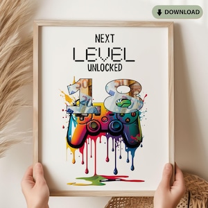 Könnte beinhalten: Gerahmter Druck mit dem Text "NEXT LEVEL UNLOCKED" über einer farbenfrohen Illustration eines Videospiel-Controllers und der Zahl "18". Die "18" ist mit Geldmotiven und tropfenden Farbeffekten gestaltet.